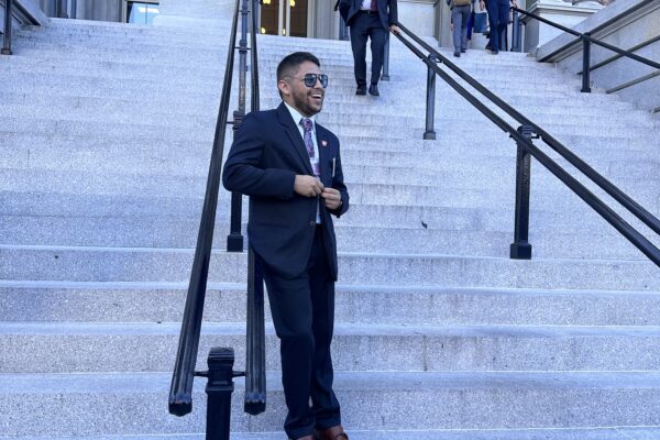 ACLU Arkansas Policy Director Kevin Azanza is seen leaning against railing on the front steps of the White House in Washington D.C.