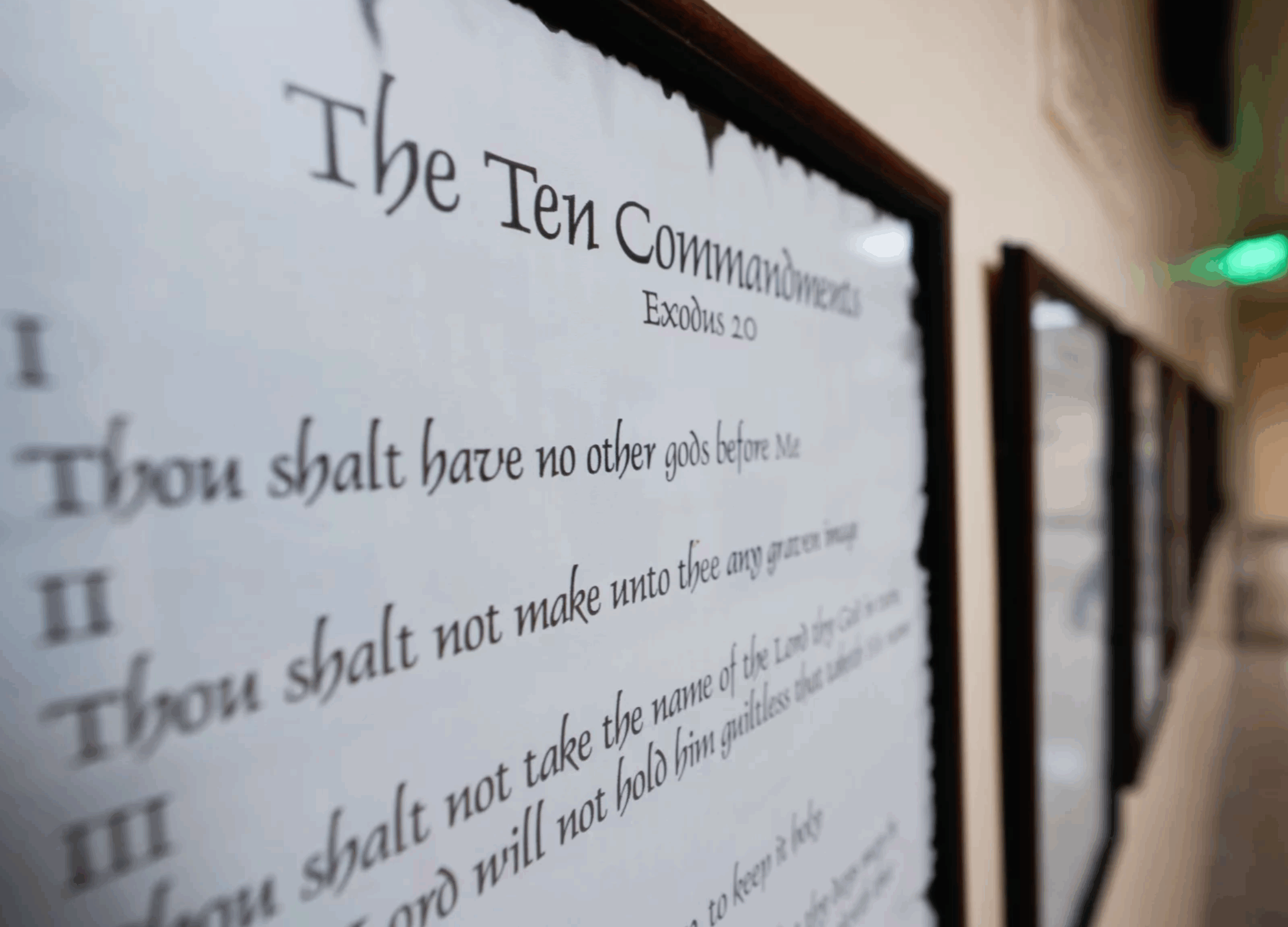 A copy of the 10 Commandments hanging in a hallway.