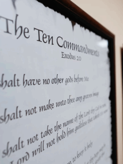 A copy of the 10 Commandments hanging in a hallway.