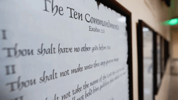 A copy of the 10 Commandments hanging in a hallway.