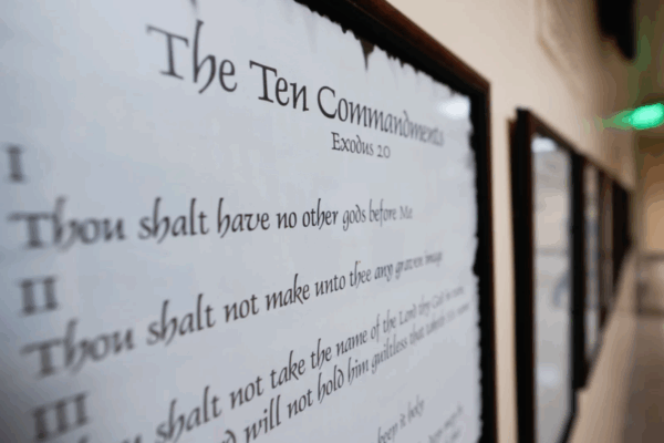A copy of the 10 Commandments hanging in a hallway.