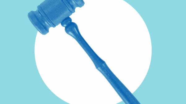 Blue gavel on blue background