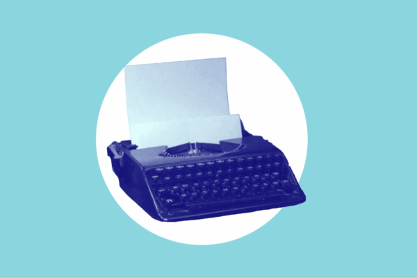 Blue typewriter on blue background.