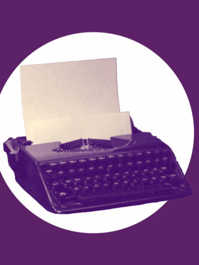 Typewriter on purple background
