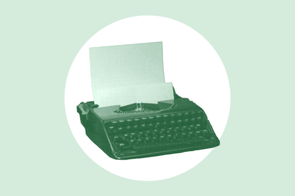 Green typewrtier on green background.