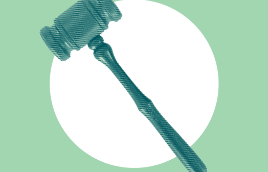A gavel on a green background.