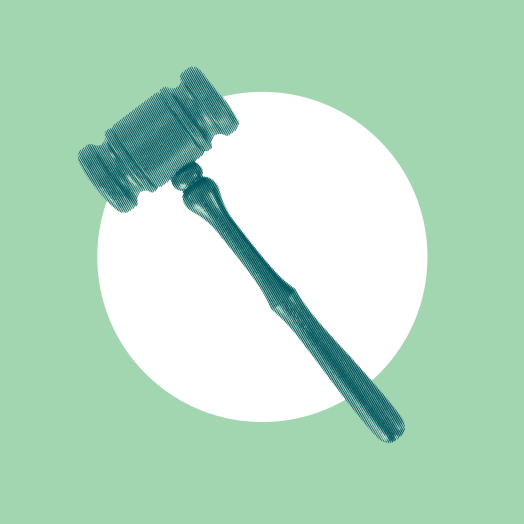 A gavel on a green background.