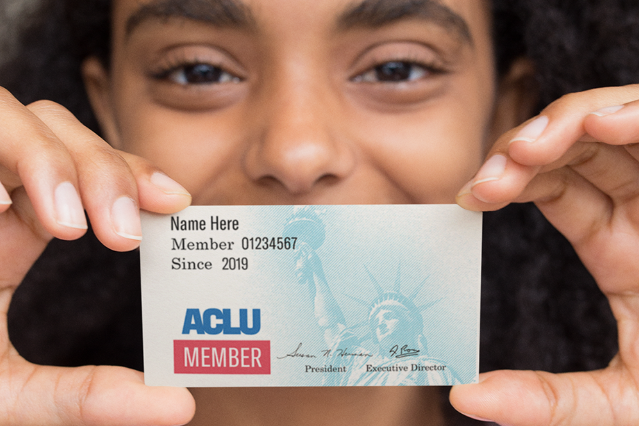 Girl holds ACLU membership card