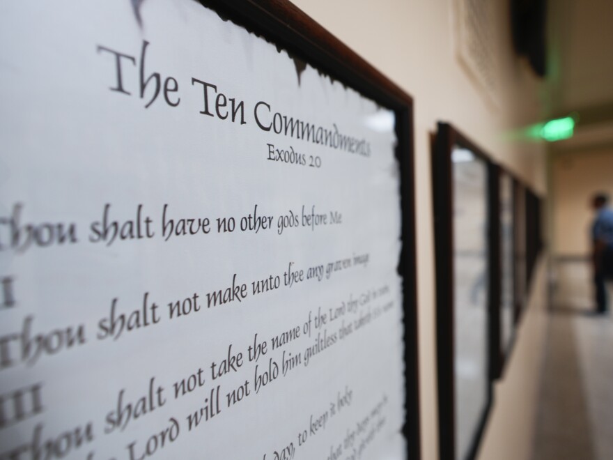 The Ten Commandments displayed on the wall.
