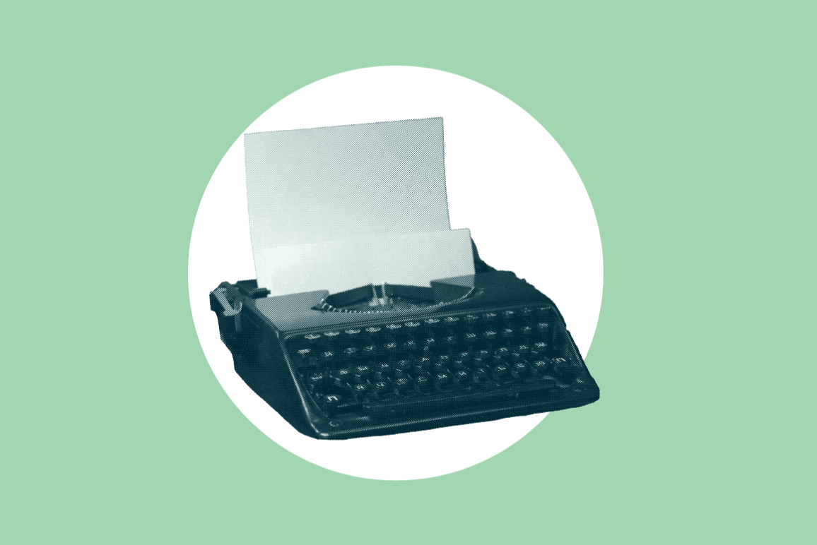 Typewriter on green background