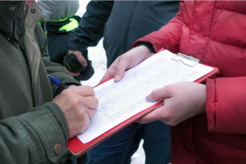Man signing public petition