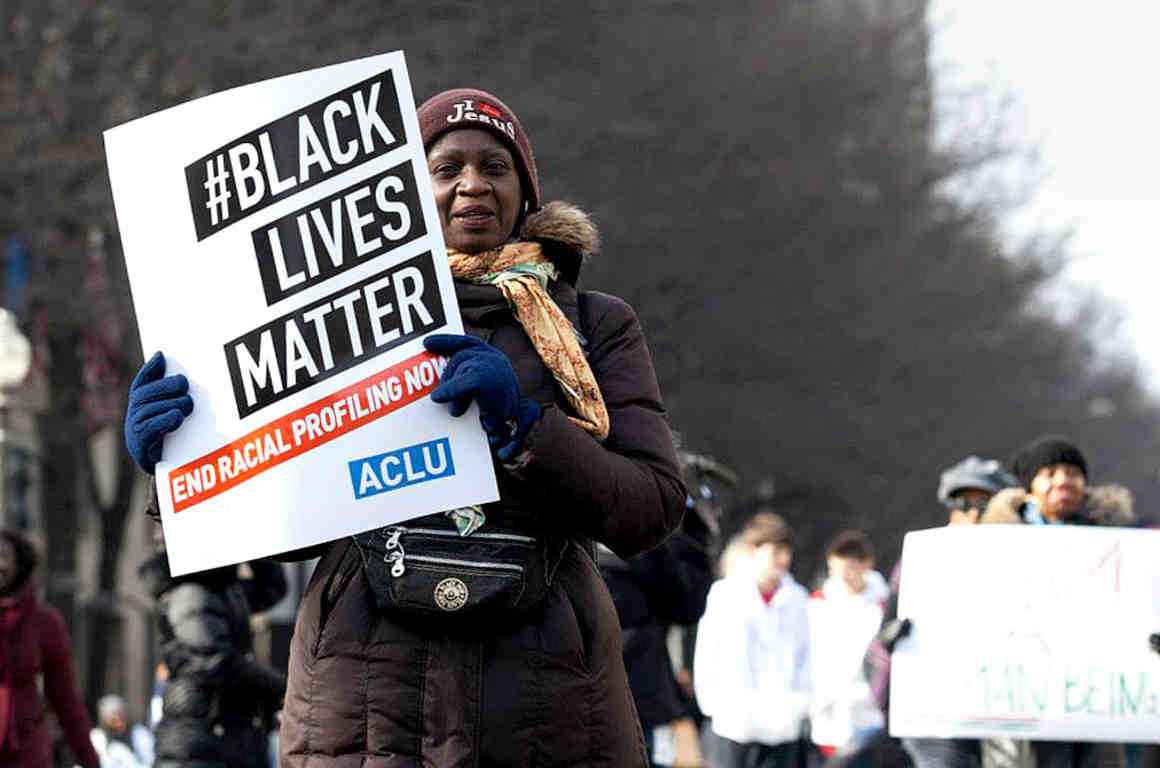 Woman holding a Black Lives Matter sign 
