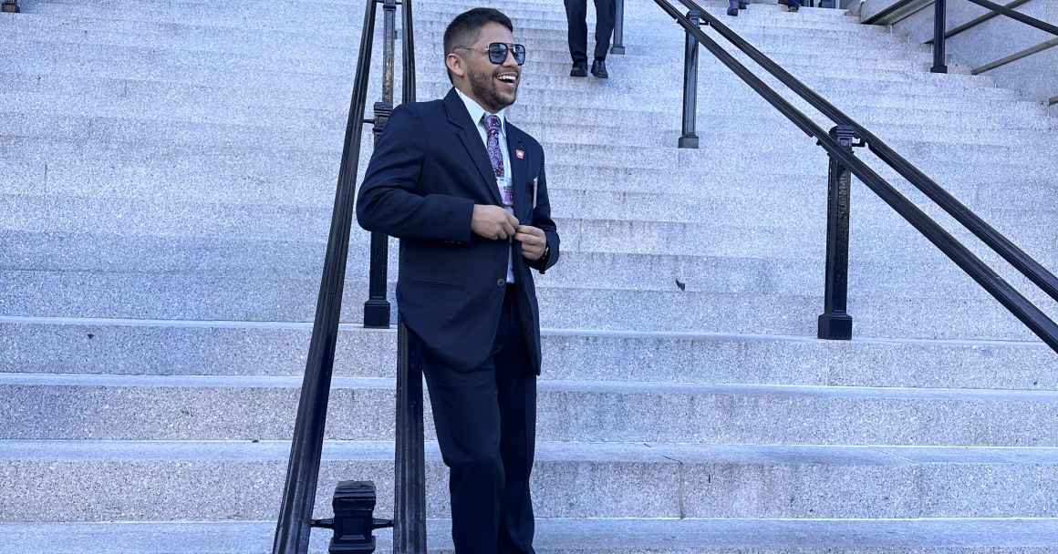 ACLU Arkansas Policy Director Kevin Azanza is seen leaning against railing on the front steps of the White House in Washington D.C.