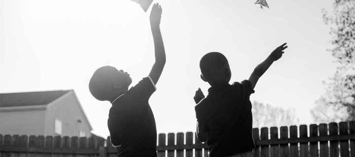 Children Flying Paper Planes