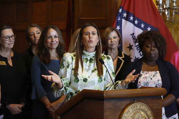 Arkansas governor Sarah Huckabee Sanders addresses press at a conference unveiling her newest executive order banning the use of gender-neutral language in Arkansas government documents