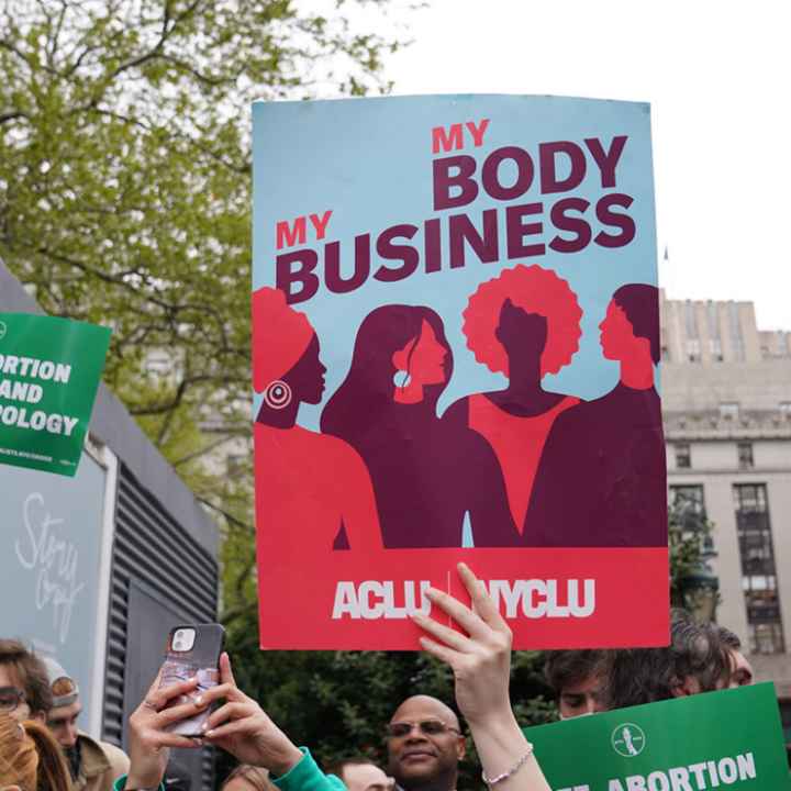 A protest sign that reads “My Body, My Business.”