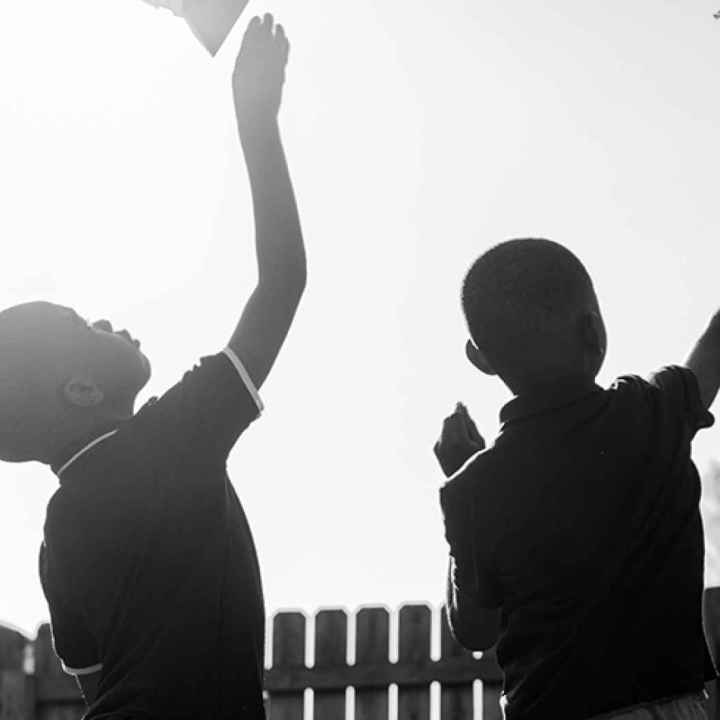 Children Flying Paper Planes