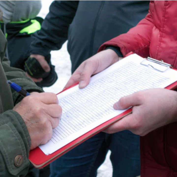 Man signing public petition